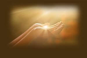 hands holding light energy